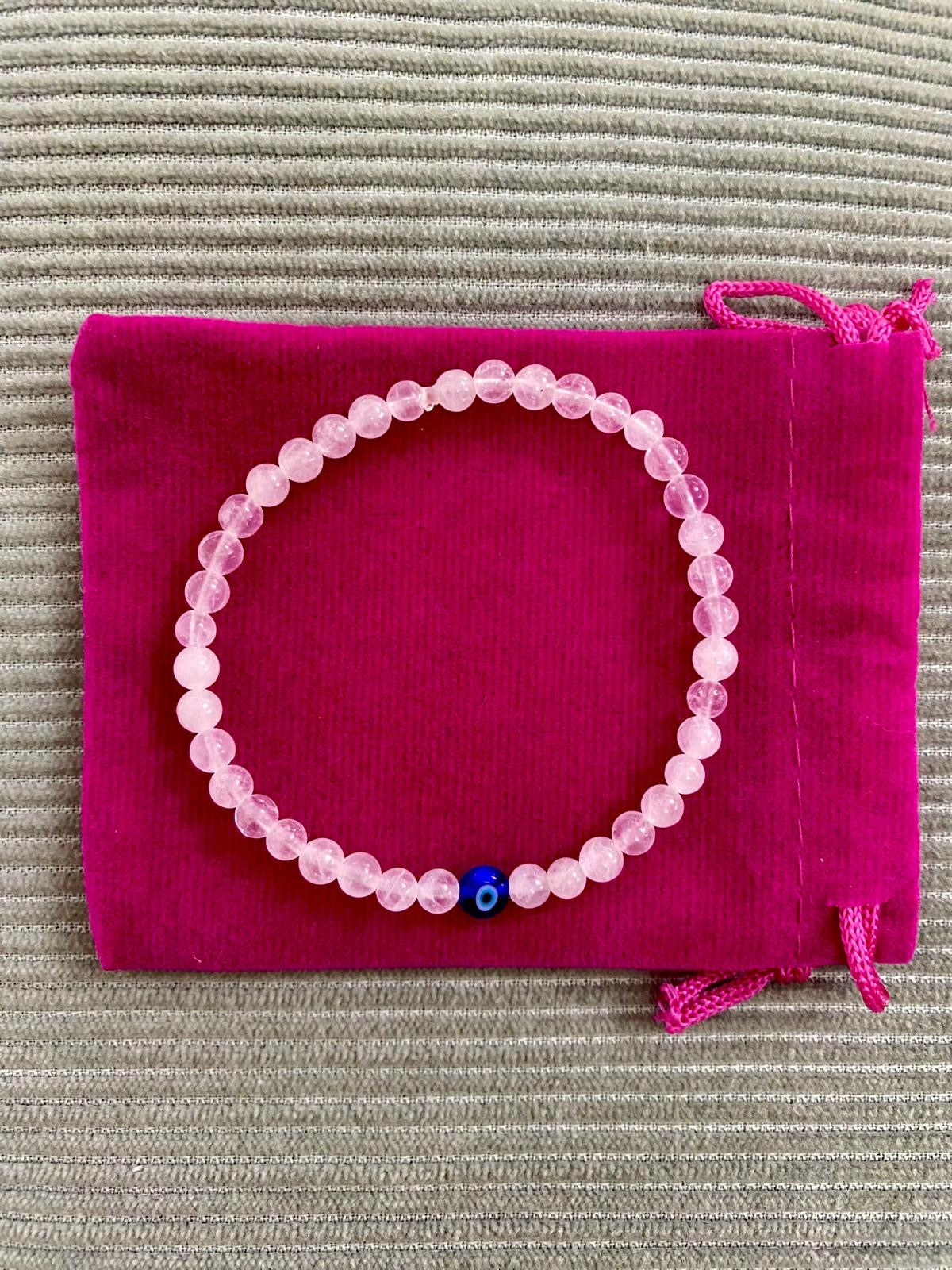 PEACHY & WILD EVIL EYE PINK GLASS BEADED BRACELET